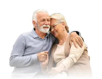 Elderly couple smiling and embracing, conveying warmth and companionship