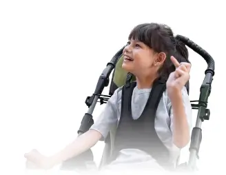 Young girl in a wheelchair smiling joyfully, representing inclusivity and happiness.