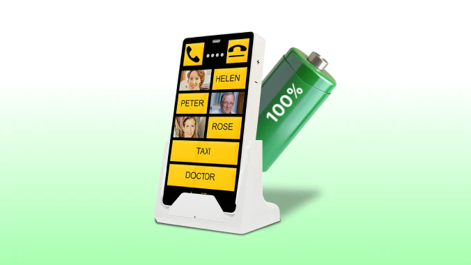 KISA Phone on a cradle next to a large green battery icon showing 100%, symbolizing full battery life for extended use.