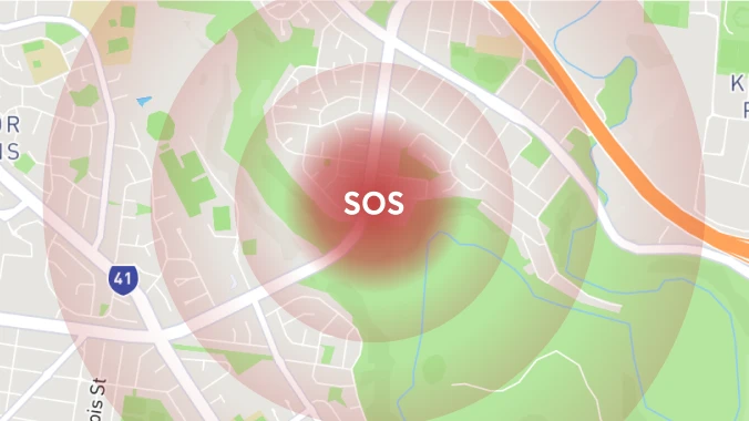 Digital map display showing an SOS alert over a specific location, indicating an emergency call activation on a city map