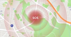 Digital map display showing an SOS alert over a specific location, indicating an emergency call activation on a city map