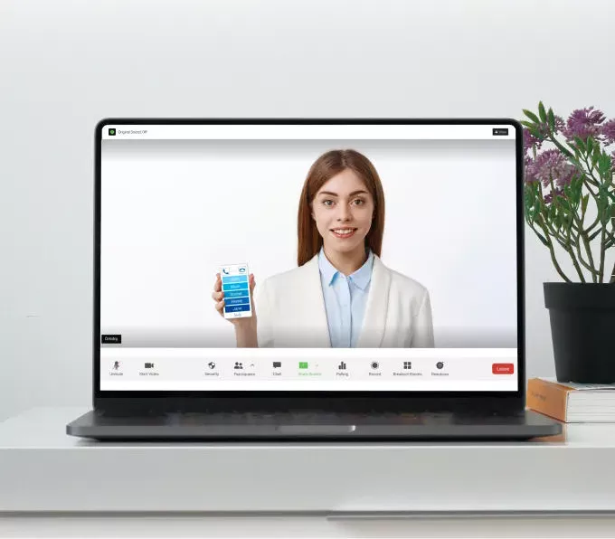 A laptop screen displaying a video call interface with a smiling woman holding a KISA Phone