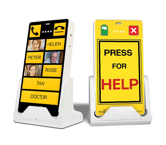 Two KISA Devices on cradles: the left one is a yellow KISA Phone, displaying contact options'; the right one is a yellow KISA Personal Alarm displaying 'PRESS FOR HELP' button for emergency assistance