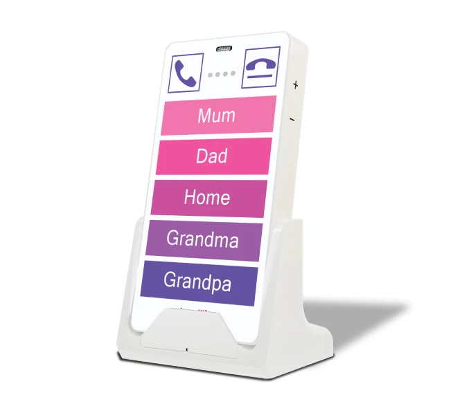 KISA Phone on a cradle displaying large, easy-to-press buttons labeled 'Mum,' 'Dad,' 'Home,' 'Grandma,' and 'Grandpa' in bright shades of purple and pink, designed for simple and accessible communication.