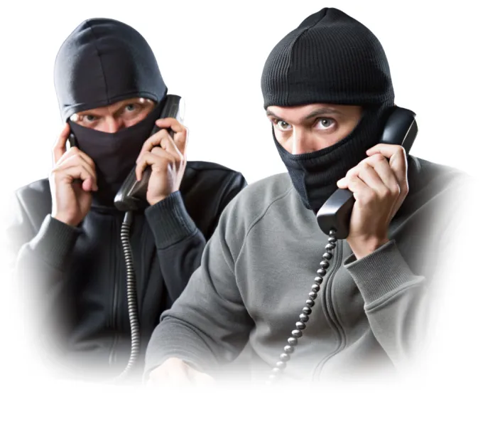 Two masked individuals making scam calls, representing the type of threats that the KISA Shield service protects against.