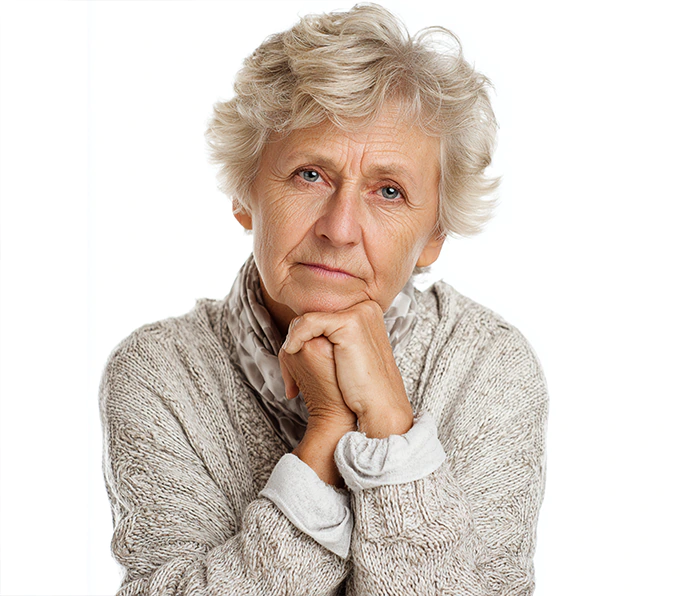 Elderly woman with thoughtful expression showcasing KISA dementia-friendly communication devices with simple one-touch calling features