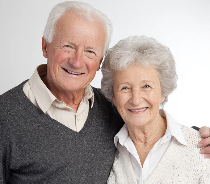 Happy elderly couple smiling together showcasing KISA assistive solutions for seniors with communication and safety needs