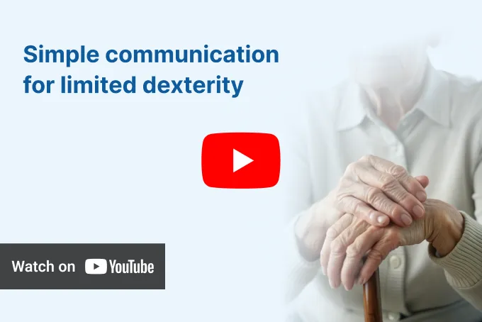 Close-up of an elderly person's hands clasped over a cane, beside text 'Simple communication for limited dexterity' and a 'Watch on YouTube' button.